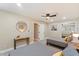 Spacious bedroom featuring two twin beds, ceiling fan, and ample closet space for all your wardrobe needs at 8213 E Fairmount Ave, Scottsdale, AZ 85251