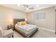 Well-lit bedroom features a queen-sized bed with end tables and neutral decor, creating a serene space at 8213 E Fairmount Ave, Scottsdale, AZ 85251