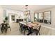 Elegant dining area with stylish lighting and an open layout that connects to the modern kitchen at 8213 E Fairmount Ave, Scottsdale, AZ 85251