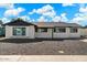 Charming single-story home with a well-maintained facade and manicured front yard, creating curb appeal at 8213 E Fairmount Ave, Scottsdale, AZ 85251