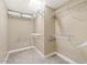 Walk-in closet featuring built-in shelving and ample storage space for all your wardrobe needs at 8213 E Fairmount Ave, Scottsdale, AZ 85251