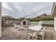 Backyard patio offers an inviting outdoor dining area with fireplace and mountain views at 8227 N 15Th Pl, Phoenix, AZ 85020