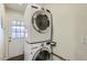Convenient laundry room with stacked washer and dryer and easy access to outdoor at 8227 N 15Th Pl, Phoenix, AZ 85020