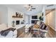 Comfortable living room featuring a fireplace, a ceiling fan, and a cozy seating arrangement at 8227 N 15Th Pl, Phoenix, AZ 85020