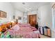 Cozy bedroom includes twin beds with patterned bedding, wood accents, and closet space at 9630 E Preserve Way, Scottsdale, AZ 85262