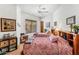 This charming bedroom features twin beds, rustic decor, and ample natural light at 9630 E Preserve Way, Scottsdale, AZ 85262
