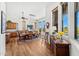 Bright dining room with wood floors, large windows, and a spacious dining table at 9630 E Preserve Way, Scottsdale, AZ 85262