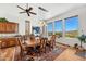 Bright dining room with wood floors, large windows, and a spacious dining table at 9630 E Preserve Way, Scottsdale, AZ 85262