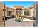 Inviting entrance with desert landscaping and decorative fountain, plus covered seating area at 9630 E Preserve Way, Scottsdale, AZ 85262