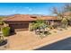 Charming desert-landscaped home with a tile roof and attached two-car garage in a sunny location at 9630 E Preserve Way, Scottsdale, AZ 85262