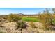 Scenic golf course view with desert vegetation, mountains in the distance at 9630 E Preserve Way, Scottsdale, AZ 85262