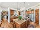 This kitchen features a large granite island, stainless steel appliances, and custom cabinets at 9630 E Preserve Way, Scottsdale, AZ 85262