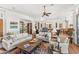 Bright living room with hardwood floors, comfortable seating, ceiling fan, and open floor plan at 9630 E Preserve Way, Scottsdale, AZ 85262