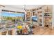Open-concept living room with fireplace, media center, and mountain views at 9630 E Preserve Way, Scottsdale, AZ 85262