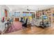 Spacious living room with fireplace, views of mountain landscape, and wood floors at 9630 E Preserve Way, Scottsdale, AZ 85262