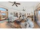 Expansive living room with hardwood floors, comfortable seating, ceiling fans, and an open layout at 9630 E Preserve Way, Scottsdale, AZ 85262