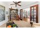 Cozy room featuring a built-in bookcase and natural light at 9630 E Preserve Way, Scottsdale, AZ 85262