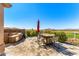 Beautiful outdoor patio area with a built-in grill, bar seating, and dining area, ideal for entertaining guests at 9630 E Preserve Way, Scottsdale, AZ 85262