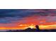 Beautiful view of a fiery sunset over the desert mountains, creating a dramatic and colorful sky at 9630 E Preserve Way, Scottsdale, AZ 85262