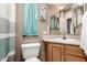 A bathroom features a toilet, sink, and curtain at 9736 E Main St # 43, Mesa, AZ 85207
