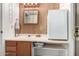 Functional bathroom featuring a sink, vanity, and a small refrigerator for added convenience at 9736 E Main St # 43, Mesa, AZ 85207