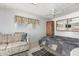 Comfortable bedroom with a sofa, ceiling fan and natural light, offering a peaceful retreat at 9736 E Main St # 43, Mesa, AZ 85207