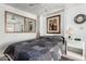 Cozy bedroom featuring a Murphy bed, mirror, and neutral decor for a relaxing retreat at 9736 E Main St # 43, Mesa, AZ 85207
