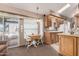 Bright kitchen dining area with a drop leaf table set and access to the exterior at 9736 E Main St # 43, Mesa, AZ 85207