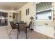 Relaxing outdoor patio with dining set adjacent to a charming manufactured home at 9736 E Main St # 43, Mesa, AZ 85207