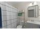 A cozy bathroom featuring a shower-tub combo with stylish curtain and bright vanity at 9853 E Birchwood Ave, Mesa, AZ 85208