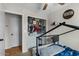 A bedroom with an open closet, showcasing plenty of storage space, and playful decor at 9853 E Birchwood Ave, Mesa, AZ 85208