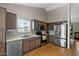 Updated kitchen with stainless appliances, modern cabinetry and durable countertops at 9853 E Birchwood Ave, Mesa, AZ 85208
