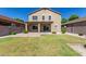 Home's backyard features well-manicured lawn and covered patio at 1021 W Vineyard Plains Dr, San Tan Valley, AZ 85143