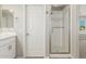 This bathroom features a vanity with a sink and a glass-door shower for a fresh and clean feel at 1021 W Vineyard Plains Dr, San Tan Valley, AZ 85143
