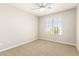 This bedroom has neutral colored carpet, and a modern ceiling fan at 1021 W Vineyard Plains Dr, San Tan Valley, AZ 85143