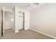 This bedroom has neutral walls, carpet, and a closet with sliding doors, creating a cozy space at 1021 W Vineyard Plains Dr, San Tan Valley, AZ 85143