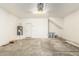 Spacious garage with water heater and white walls at 1021 W Vineyard Plains Dr, San Tan Valley, AZ 85143