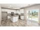 Bright kitchen boasts granite countertops, an island, stainless appliances, and ample cabinet space at 1021 W Vineyard Plains Dr, San Tan Valley, AZ 85143