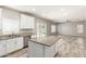Bright kitchen island with modern appliances and granite countertops, seamlessly connected to the living area at 1021 W Vineyard Plains Dr, San Tan Valley, AZ 85143