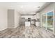 Open kitchen area features white cabinets, granite counters, and stainless steel appliances at 1021 W Vineyard Plains Dr, San Tan Valley, AZ 85143