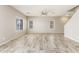 Bright, open living room features tile floors, neutral paint and ample natural light from windows at 1021 W Vineyard Plains Dr, San Tan Valley, AZ 85143