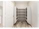 Walk-in pantry features ample shelving and convenient storage space in white interior at 1021 W Vineyard Plains Dr, San Tan Valley, AZ 85143