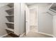 Walk-in closet with an open door and lots of shelving, providing ample storage space and accessibility at 1021 W Vineyard Plains Dr, San Tan Valley, AZ 85143