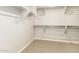 Spacious walk-in closet with rods and shelving, perfect for organizing and storing clothes and accessories at 1021 W Vineyard Plains Dr, San Tan Valley, AZ 85143