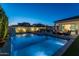 Backyard view of modern pool, spa and patio with outdoor furniture and landscaping, perfect for entertaining at 10511 E Diffraction Ave, Mesa, AZ 85212