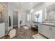 Luxurious primary bathroom with double vanity, a large shower, and elegant herringbone floors at 10511 E Diffraction Ave, Mesa, AZ 85212