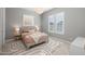 Serene bedroom with soft lighting, a plush bed, and a calming color palette for a peaceful retreat at 10511 E Diffraction Ave, Mesa, AZ 85212
