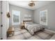 Inviting bedroom with a gray color scheme, comfortable furnishings, and plenty of natural light at 10511 E Diffraction Ave, Mesa, AZ 85212