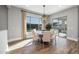 Bright dining room features a modern chandelier and views of the backyard pool area at 10511 E Diffraction Ave, Mesa, AZ 85212
