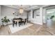 Elegant dining room featuring modern chandelier, stylish decor, and wood-look tile flooring at 10511 E Diffraction Ave, Mesa, AZ 85212